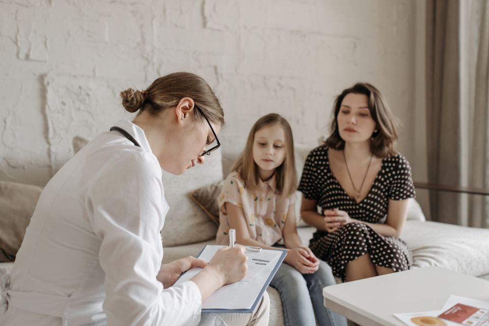 Family physician consulting with a patient in a primary care clinic